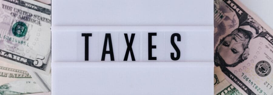 quote box ontop of stack of paper bills